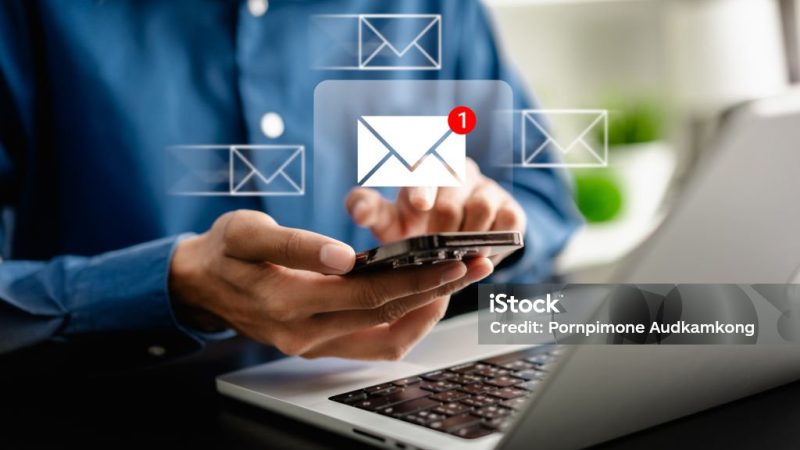 Businesswomen using smartphones check New email notifications and business digital online marketing. Inbox receiving electronic message alert. icon envelope virtual screen, communication technology.